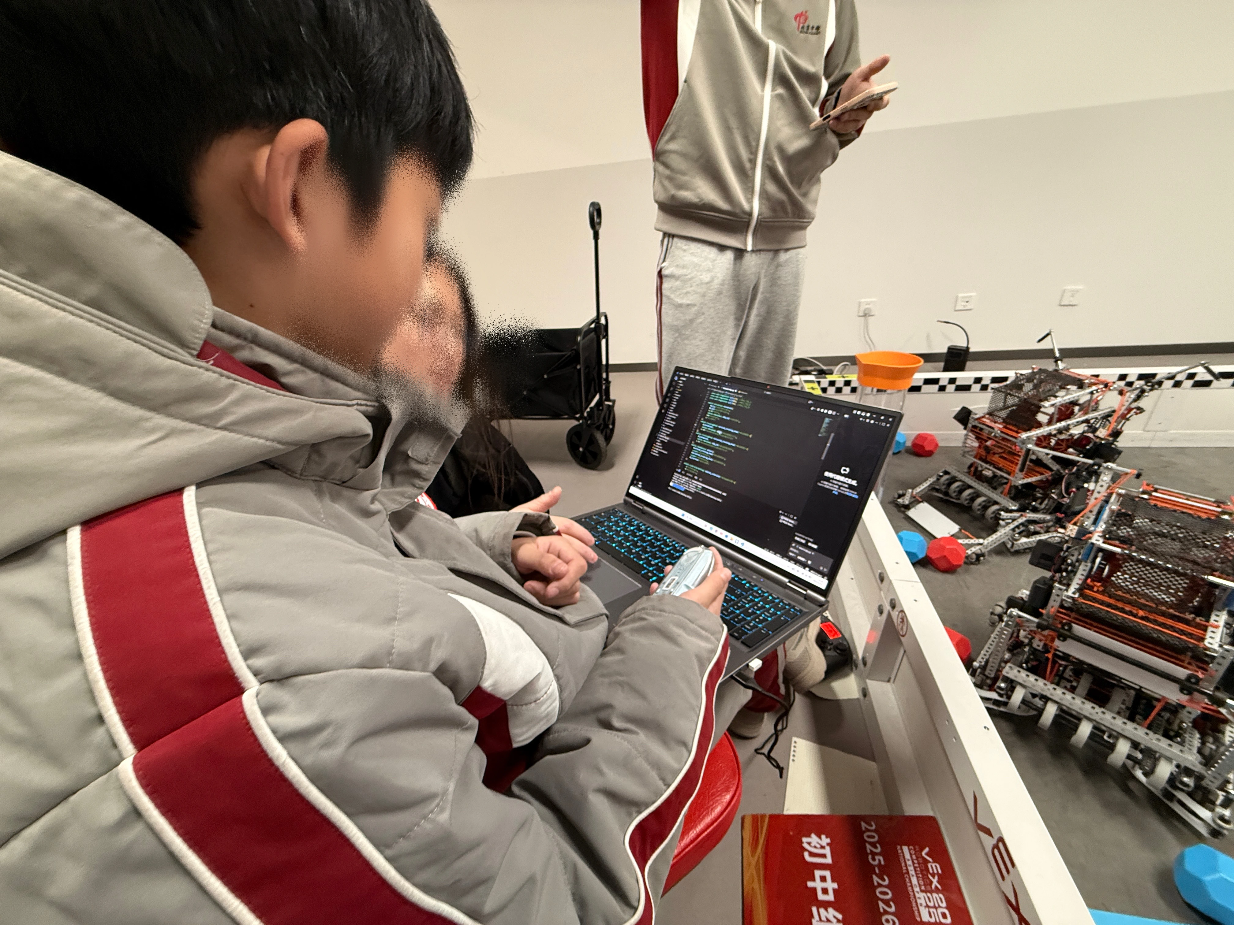 Beijing Academy students working together on a VEX robot